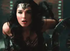 Wonder Woman winks and smiles