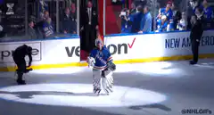 Hockey goalie celebrates in spotlight