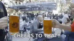 Two people clinking beer mugs cheers to that