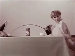 Woman pours coffee with a long tube