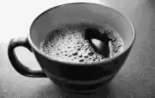 Stirring coffee in a cup
