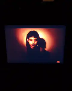 Woman with bangs under spotlight