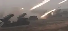 missile launchers firing in desert