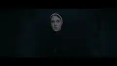 The Nun looks in a mirror