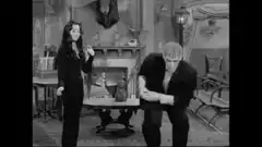 Morticia and Lurch dancing