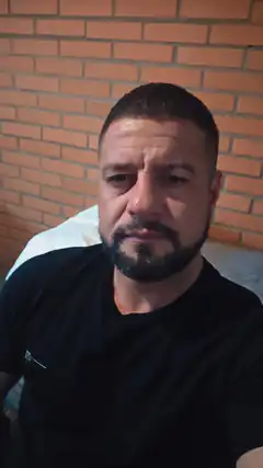 Man with beard looking at camera