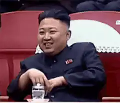 Kim Jong Un waving and smiling