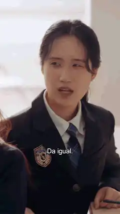 Girl in school uniform looks back