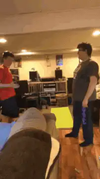 Two men play rock paper scissors