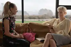 Two women talking then man excitedly waving