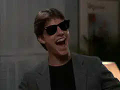 Tom Cruise laughing in sunglasses