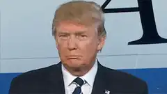 Donald Trump smirking and closing eyes