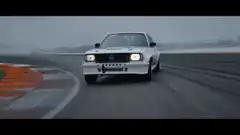 White Mazda RX-7 drifting on a track