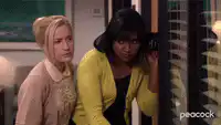 Pam and Kelly spying through blinds