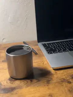 shaking metal cup on desk