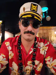 Man in captain hat smoking with glowing mouth