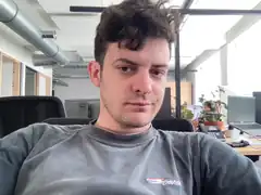 Man in office looking at camera