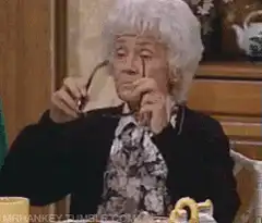 Lucille Ball puts on sunglasses