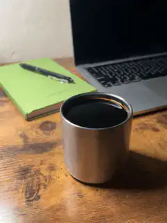 steaming metal cup on desk