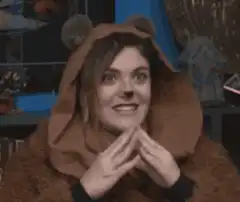 Woman in bear onesie making cute faces