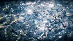 sparkling light on wet rocks