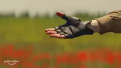 Two hands holding in a field