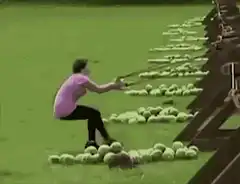 Woman pulled by tennis ball machine