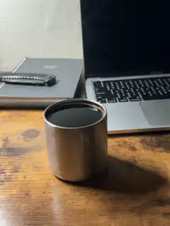 metal cup on desk
