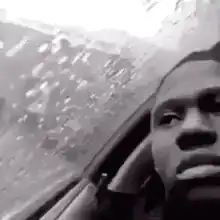 Man in car looking sad in rain