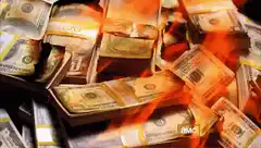 bundles of cash burning