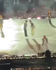 Two men bowing on stage