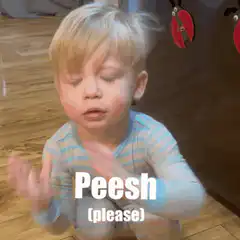 Toddler doing the peesh gesture