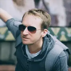 Man with sunglasses shooting lasers from eyes