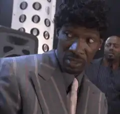 Man in suit laughing hysterically