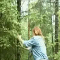 woman hugging a tree in forest