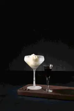 Pouring coffee liqueur over ice cream