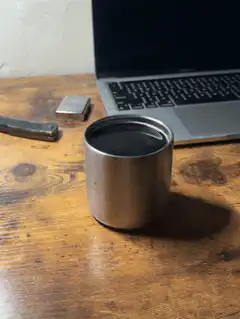 Steam rising from a metal cup