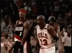 Michael Jordan shrugs at Clyde Drexler