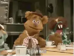 Fozzie Bear swears at the table