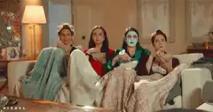 Four women watching a scary movie