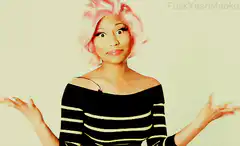 Nicki Minaj shrugs and smiles