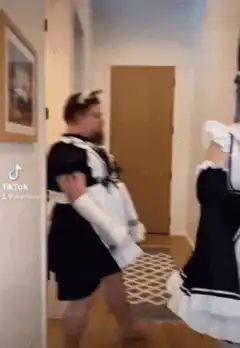 Man in maid outfit turns around