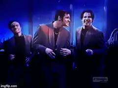 Three men dancing in a club