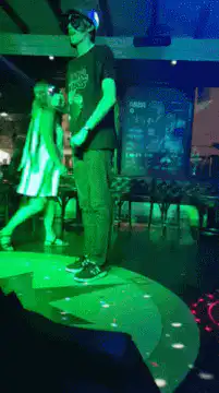 Man dancing on light-up floor