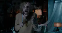 Scary woman screaming in dark room