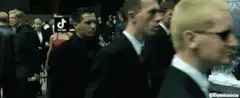 Agent Smith walks past social media logos