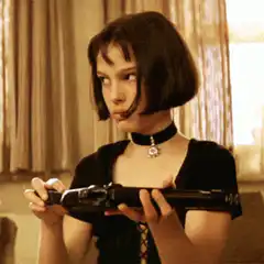 Matilda holding a gun