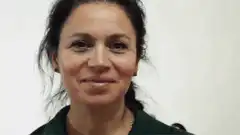Woman proudly showing German passport