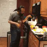 Man dancing in kitchen while cooking