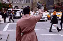 Buddy the Elf high fives a man